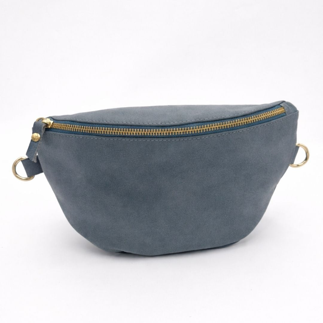 Blue suede fanny pack with gold zipper on a white background